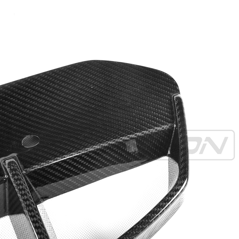 BMW X3 G01 carbon fibre front bumper vent trims by CT Carbon, close-up of sleek, lightweight accessory with textured carbon finish.