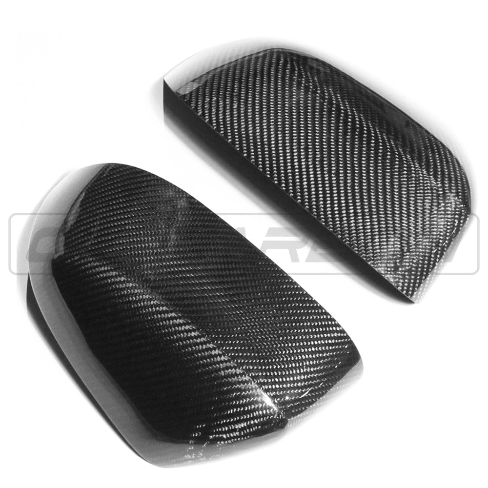 BMW X3/X4/X5/X6 G01/G02/G05/G06 carbon fiber mirror covers by CT Carbon, OEM style, showing glossy black textured finish.