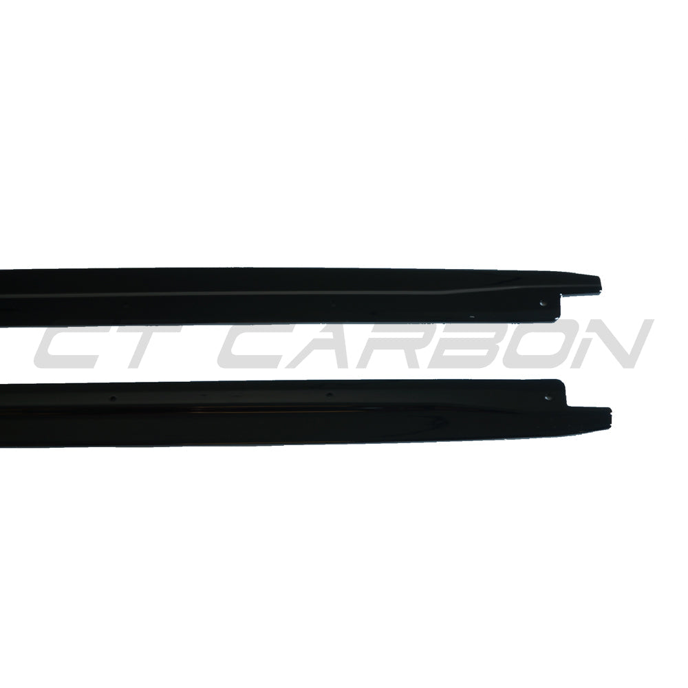 BMW X5 2014-2018 F15 CT Carbon gloss black full-length side skirts installed on vehicle, showcasing sleek side profile.