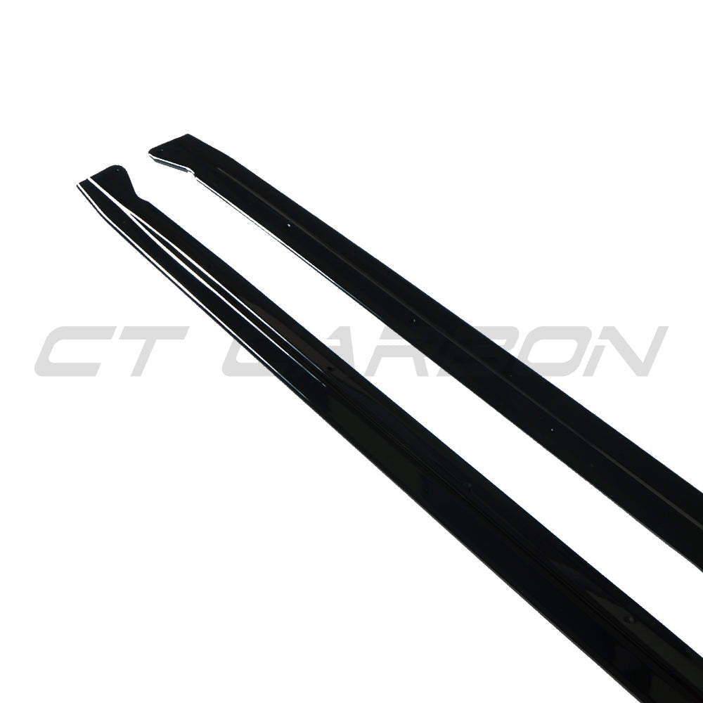 BMW X5 2014-2018 F15 CT Carbon gloss black full-length side skirts installed on vehicle, showcasing sleek automotive styling.