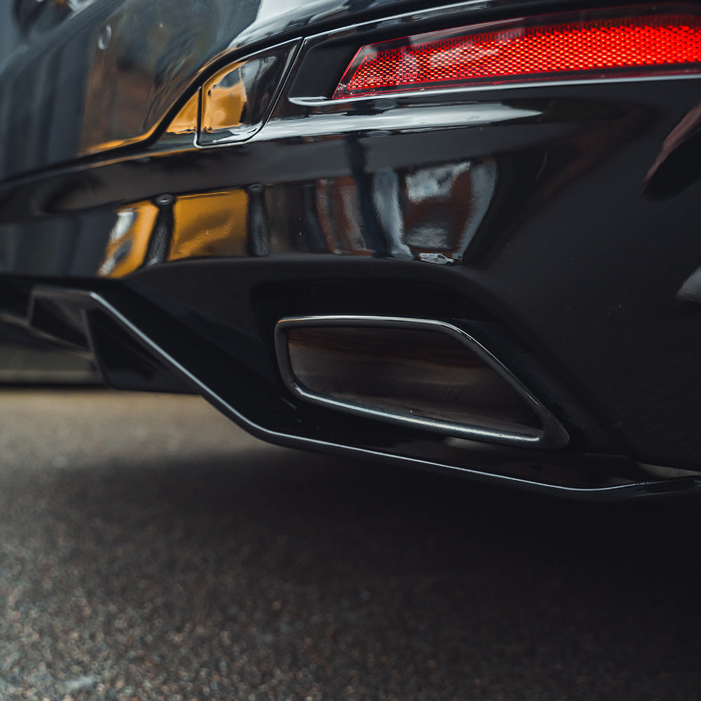 BMW G30 G31 5 Series 2020-2024 LCI CT Carbon gloss black diffuser, automotive part with sleek black finish and aerodynamic design.