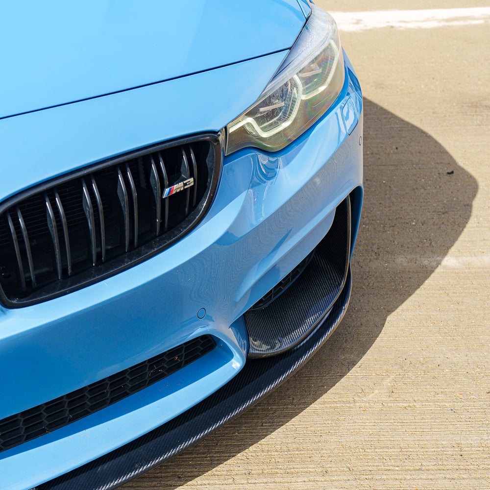 Blue BMW M3 F80 with CT Carbon full carbon fiber kit, showcasing sleek exterior enhancements and sporty design details.