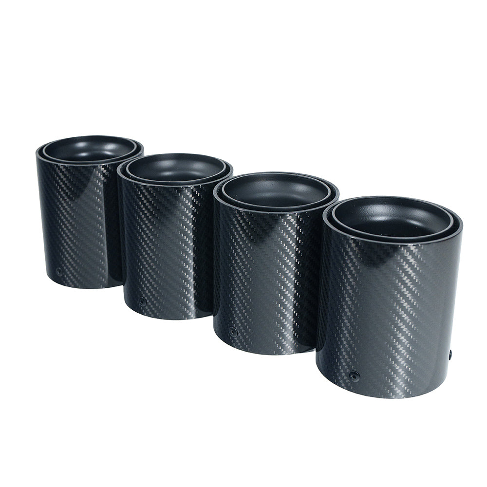 Set of four matte black BMW F90/F92 M5 carbon fiber exhaust tips by CT Carbon, showcasing sleek, high-performance car accessory.