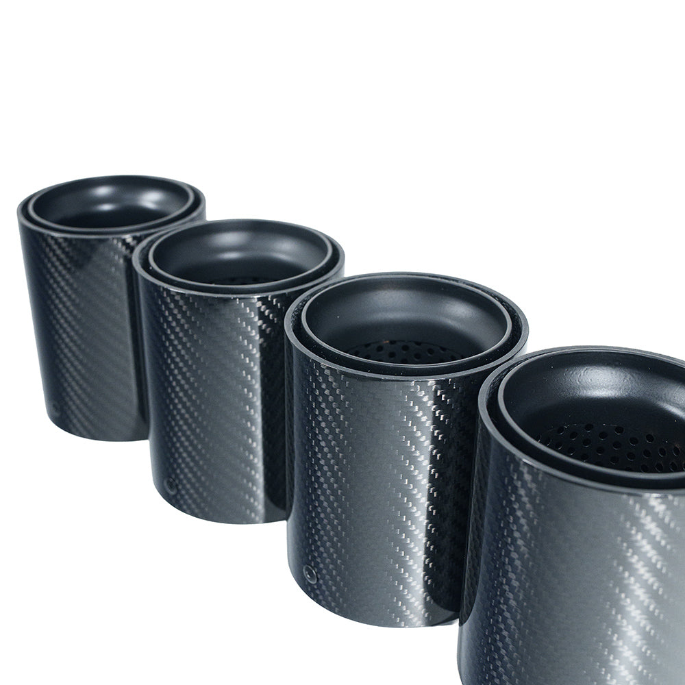 Set of four matte black carbon fiber exhaust tips for BMW F90/F92 M5 by CT Carbon, showcasing sleek, high-performance design.