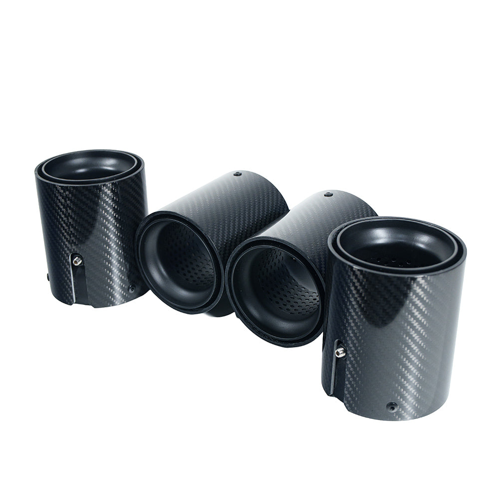 Four matte black BMW F90/F92 M5 Carbon Fibre Exhaust Tips by CT Carbon, showcasing sleek, high-performance exhaust styling.