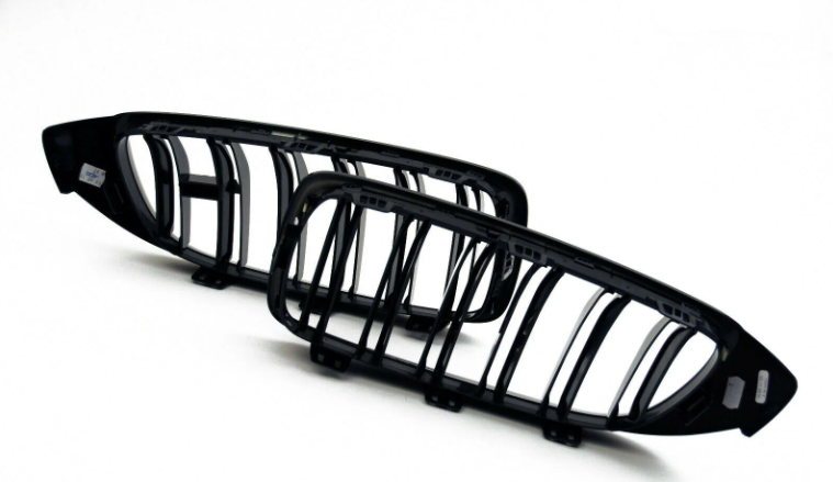 Genuine BMW M Performance F82 F83 front black kidney grilles pair for M4, featuring sleek design and authentic BMW branding.