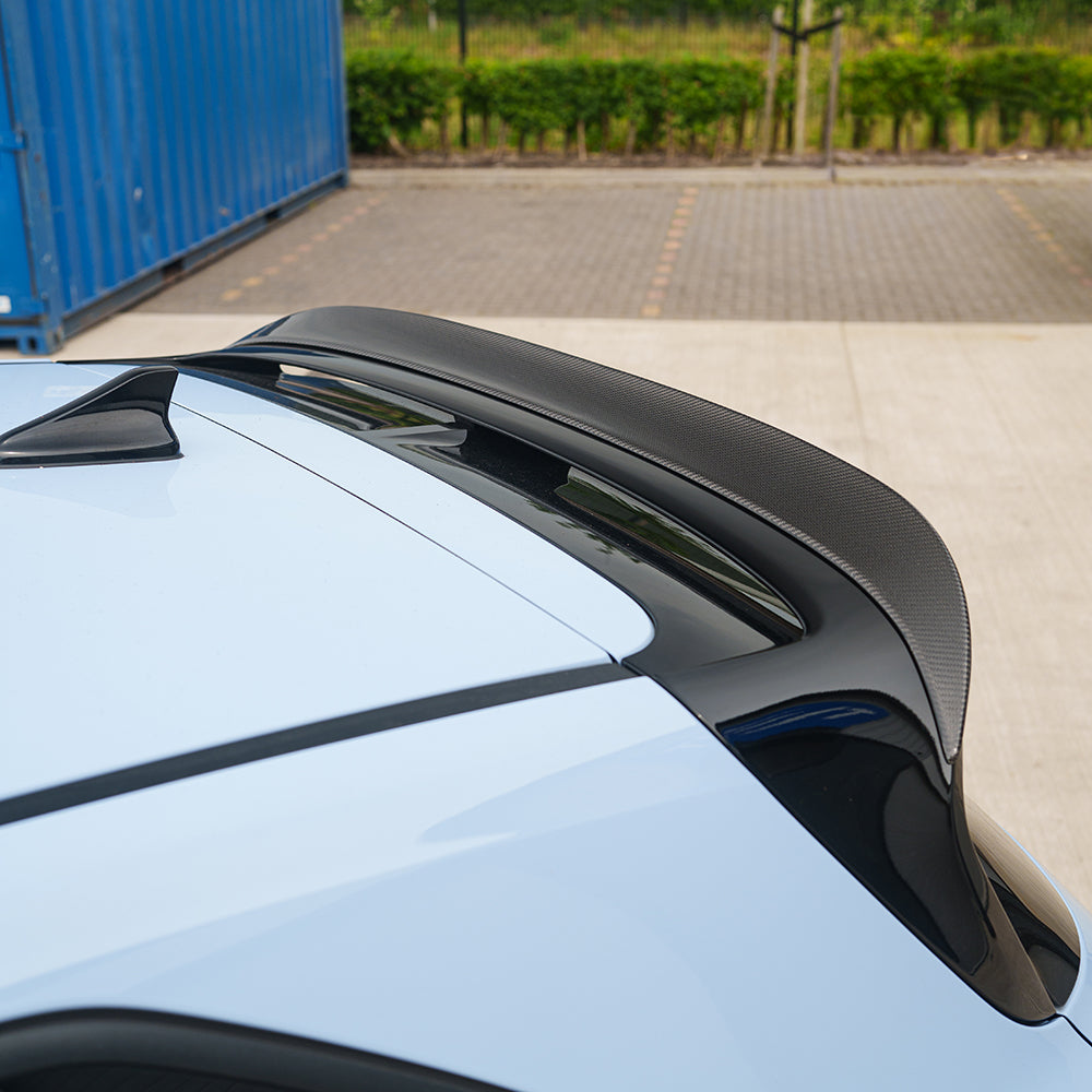 Hyundai i30N carbon fibre spoiler by CT Carbon, showing the sleek aerodynamic design with a glossy finish on the car's rear.