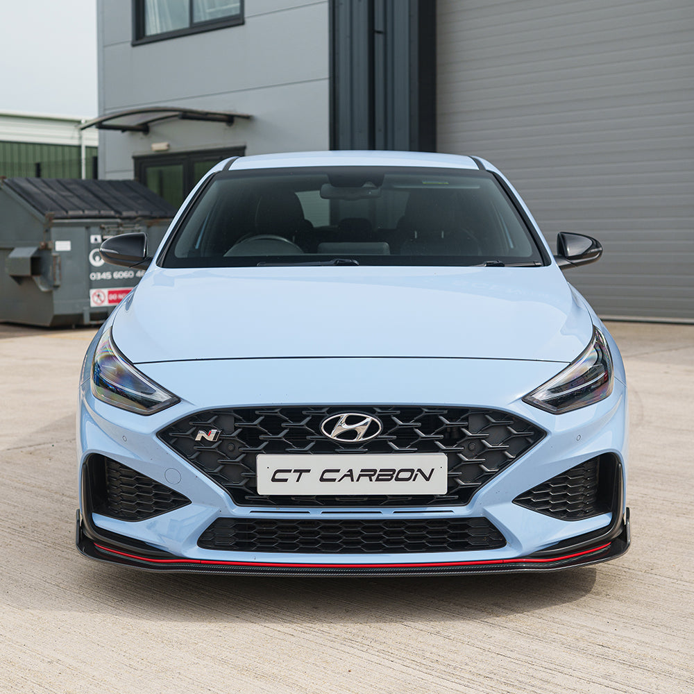 HYUNDAI i30N front carbon fiber splitter by CT Carbon, designed for facelift models, installed on the front bumper.