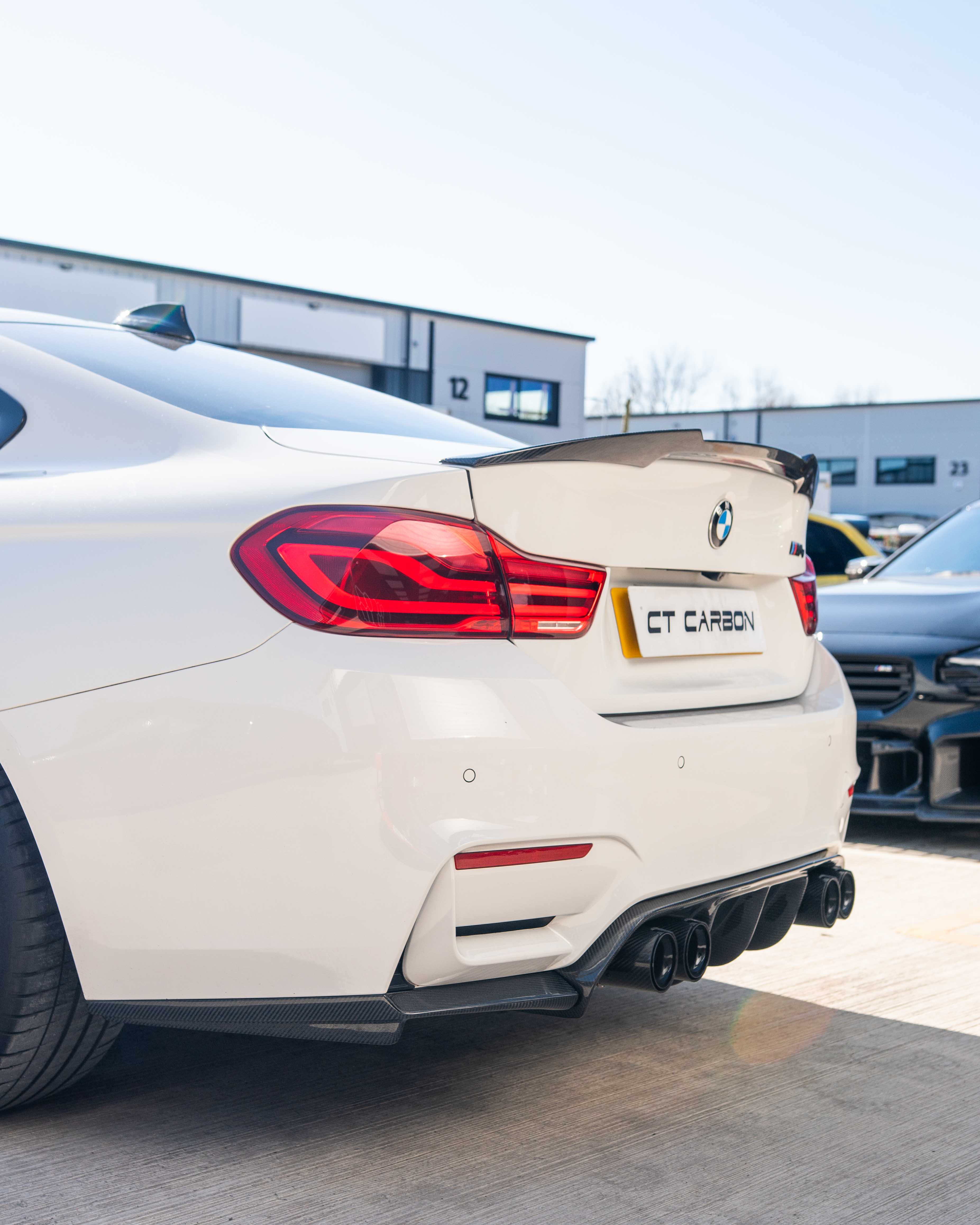 BMW F82 M4 coupe 2014-2020 CT Carbon full carbon fibre kit, showing front bumper, side skirts, and rear diffuser on the car.