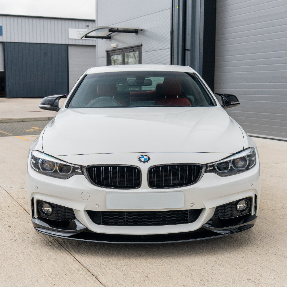 BMW 4 Series F32/F33/F36 CT Carbon gloss black splitter installed on front bumper with detailed close-up view.