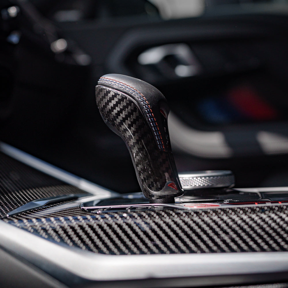 CT Carbon gear selector cover for BMW G80 G82 G87 M2 M3 M4 2021+ interior accessory, durable carbon fiber finish.
