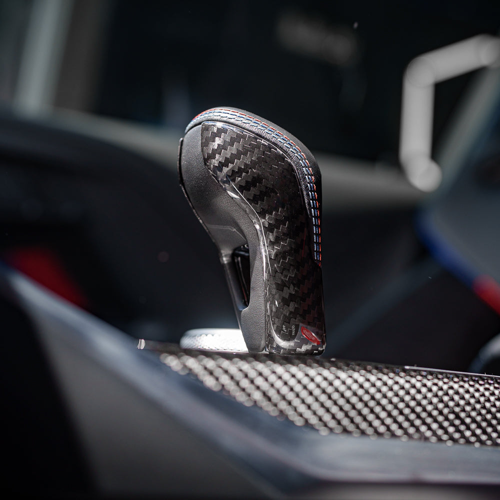 CT Carbon gear selector cover for BMW G80 G82 G87 M2 M3 M4 2021+ interior accessories, sleek carbon fiber design.