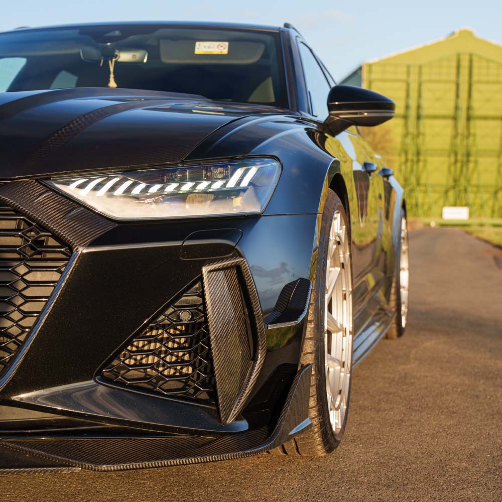 Audi RS6 C8 2019+ CT Design full carbon fiber kit, showing close-up of textured carbon fiber components on the car.
