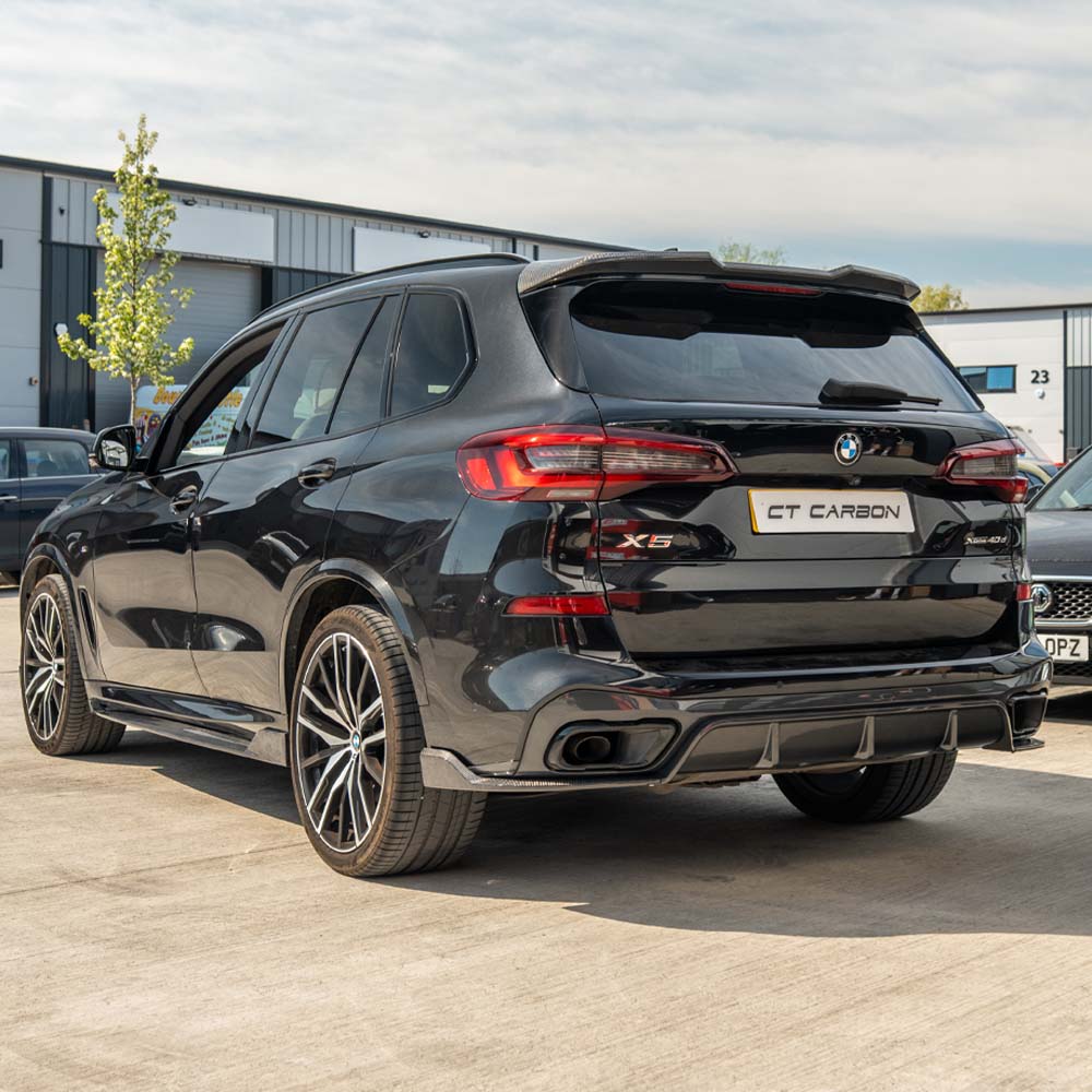 BMW G05 X5 CT Carbon full car carbon fiber kit, V1, showing sleek black carbon fiber panels on the vehicle's exterior.