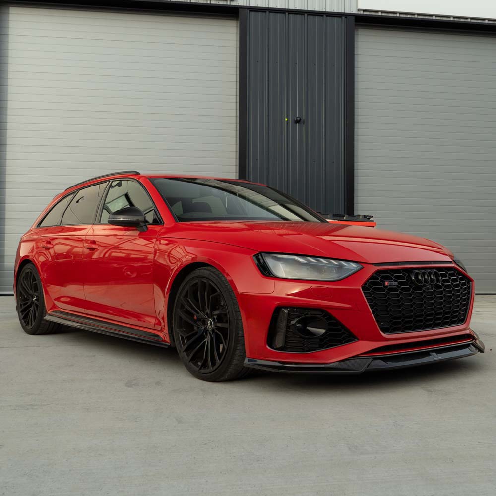 Carbon fiber kit for Audi RS4 B9.5 by CT Carbon, featuring sleek carbon fiber components on a car.