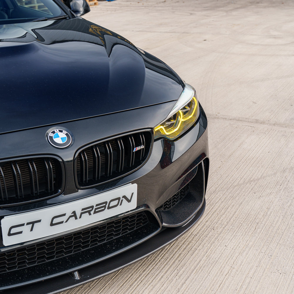 BMW F82 M4 Coupe 2014-2020 CT Carbon full carbon fibre kit installed on the vehicle, showcasing lightweight, high-performance exterior parts.