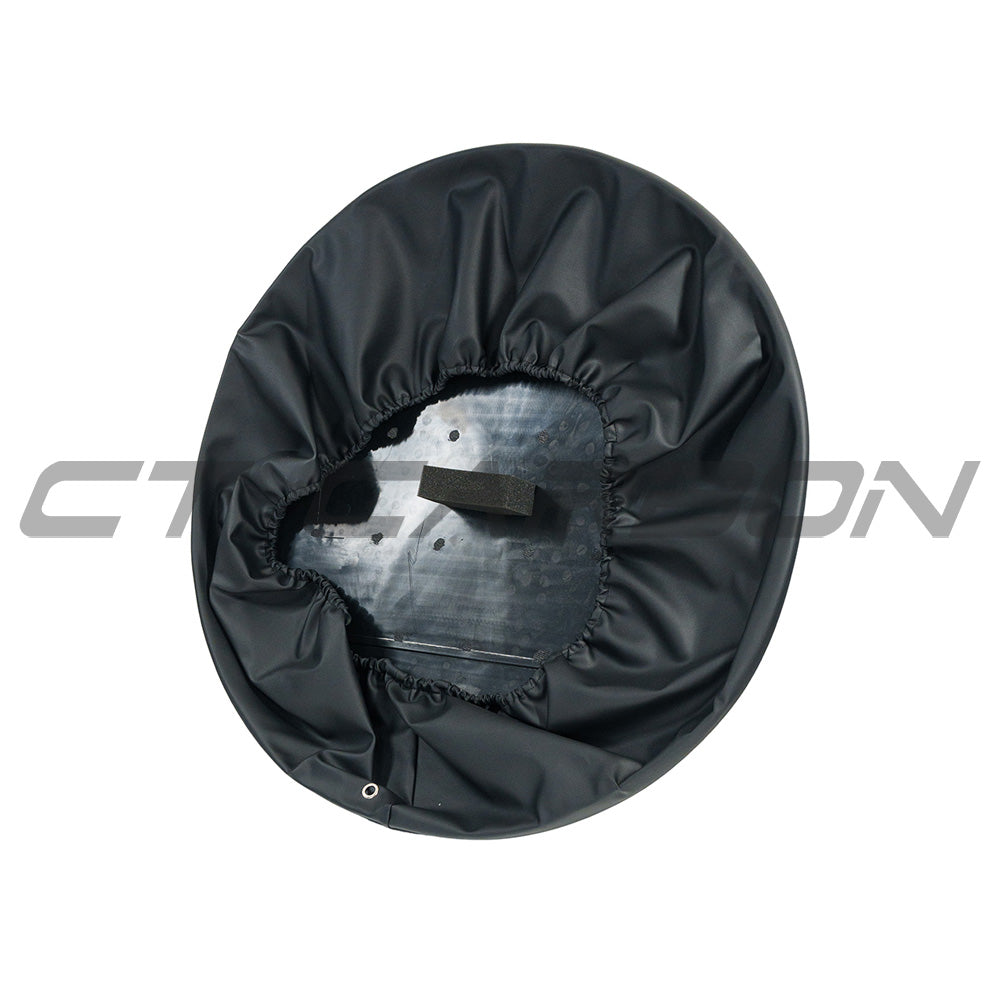 Gloss black spare wheel cover for Land Rover Defender L663 110 and 90 by CT Carbon, showcasing sleek accessory design.