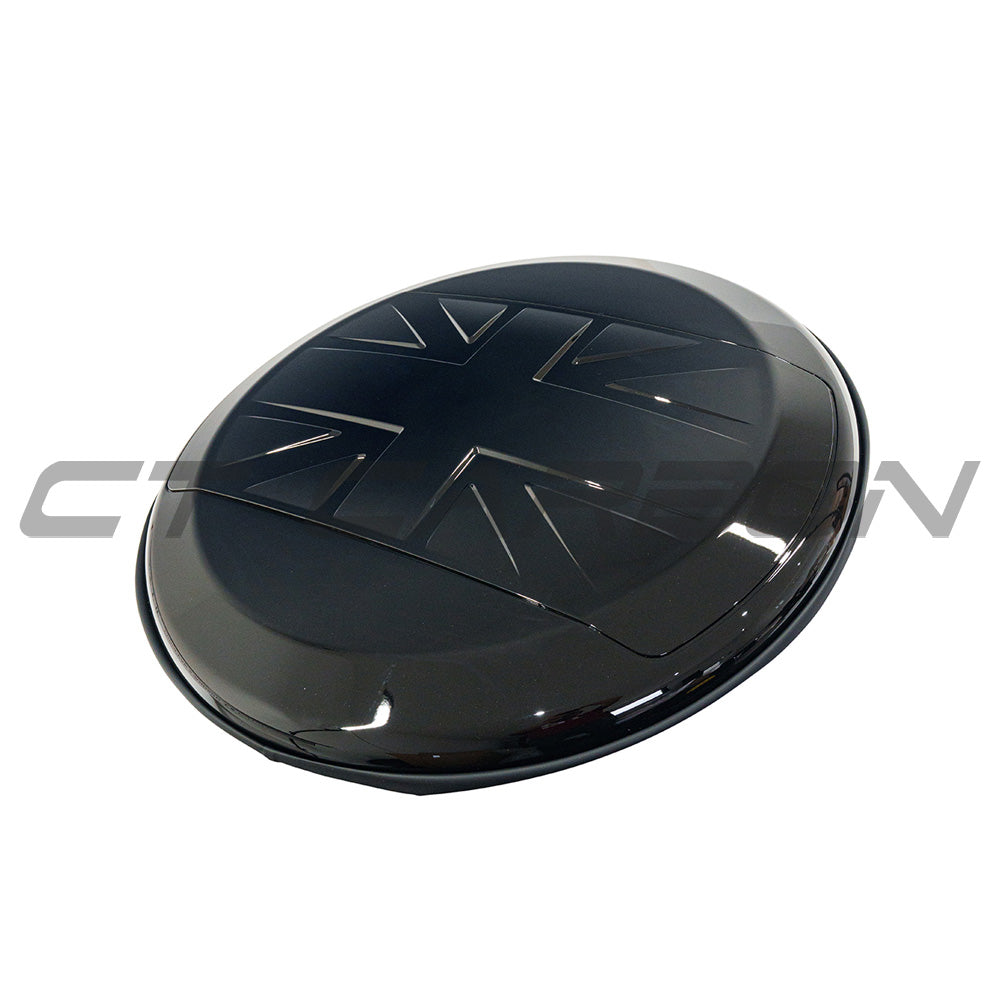 Gloss black Land Rover Defender L663 spare wheel cover by CT Carbon, designed for 110 and 90 models, shown on a vehicle.