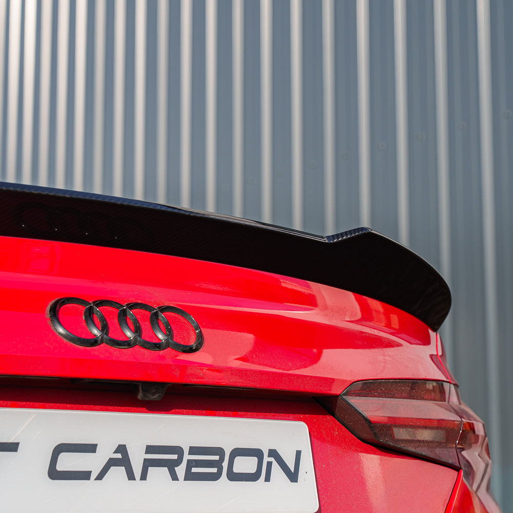 Carbon fibre spoiler for Audi A5/S5/RS5 B9/B9.5 coupe by CT Carbon, visible on a sleek black car in the image.