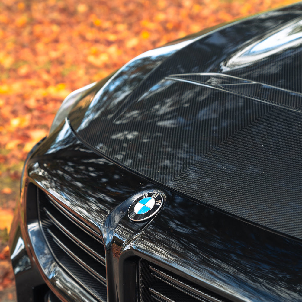 BMW G42 2 Series and G87 M2 carbon fibre front bonnet by CT Carbon, showing sleek, lightweight design and glossy finish.