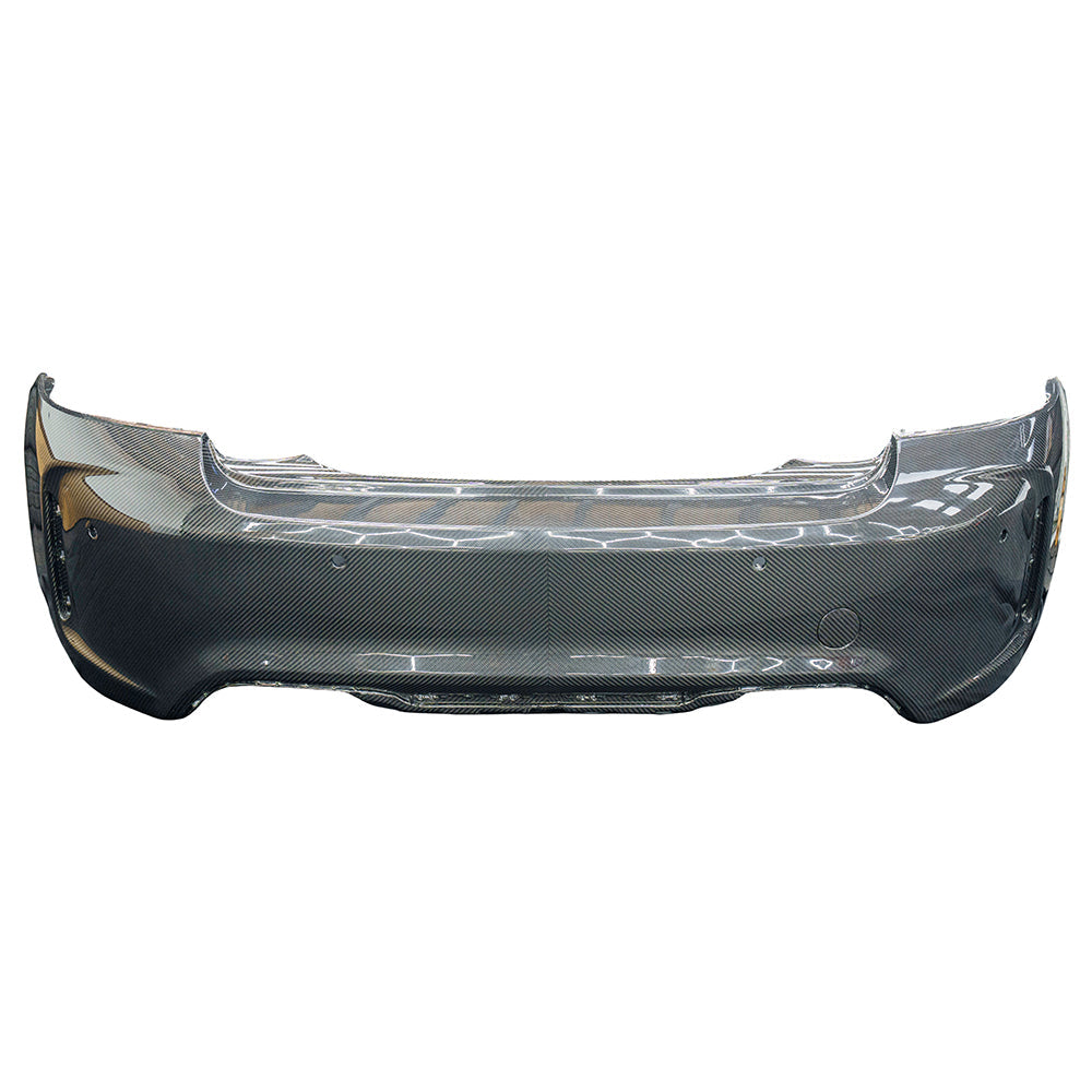 BMW F87 M2 Carbon Pre-Preg Fibre Rear Bumper by CT Carbon, featuring sleek black carbon fiber with a smooth finish.