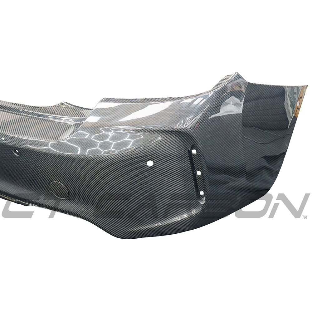BMW F87 M2 Carbon Pre-Preg Fibre Rear Bumper by CT Carbon, showcasing sleek, lightweight automotive bumper with carbon fiber finish.