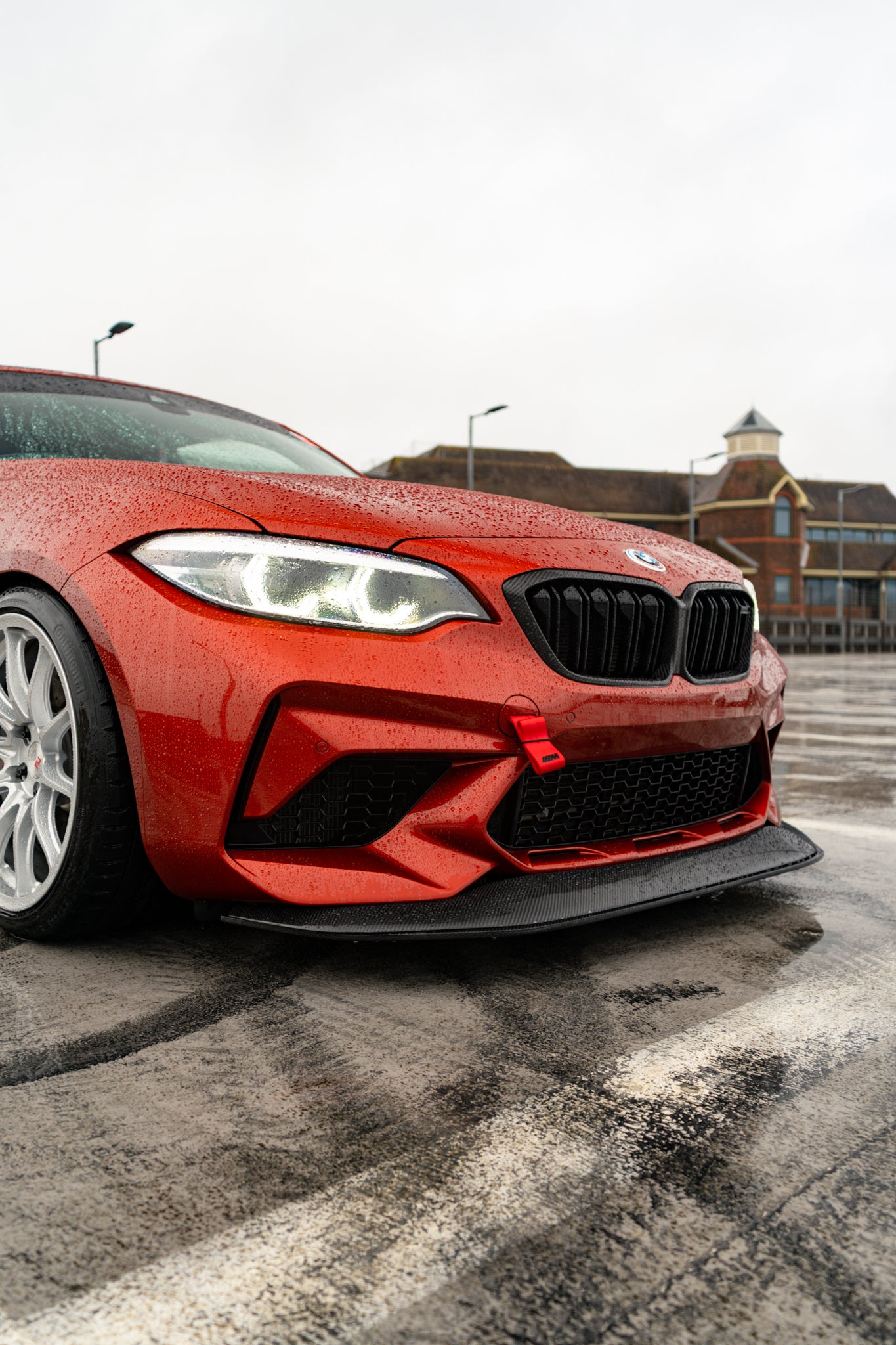 Ridgeline Motorsport carbon fibre GTS front splitter for BMW M2 Competition F87, showing its aerodynamic design and sleek finish.