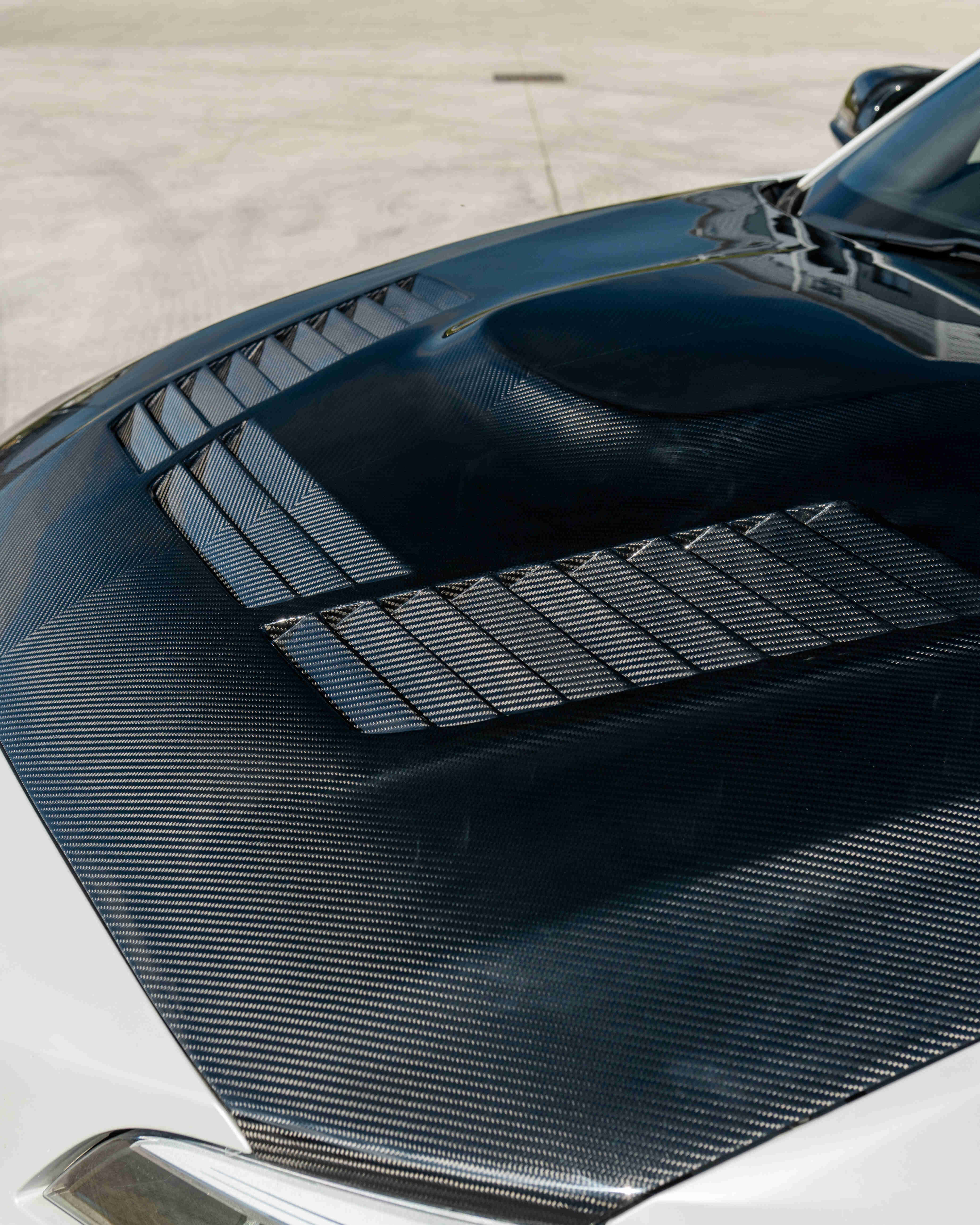 BMW M2 M2C F87 F20 F22 carbon fiber bonnet by CT Carbon, showing sleek, lightweight carbon fiber car hood with detailed weave pattern.