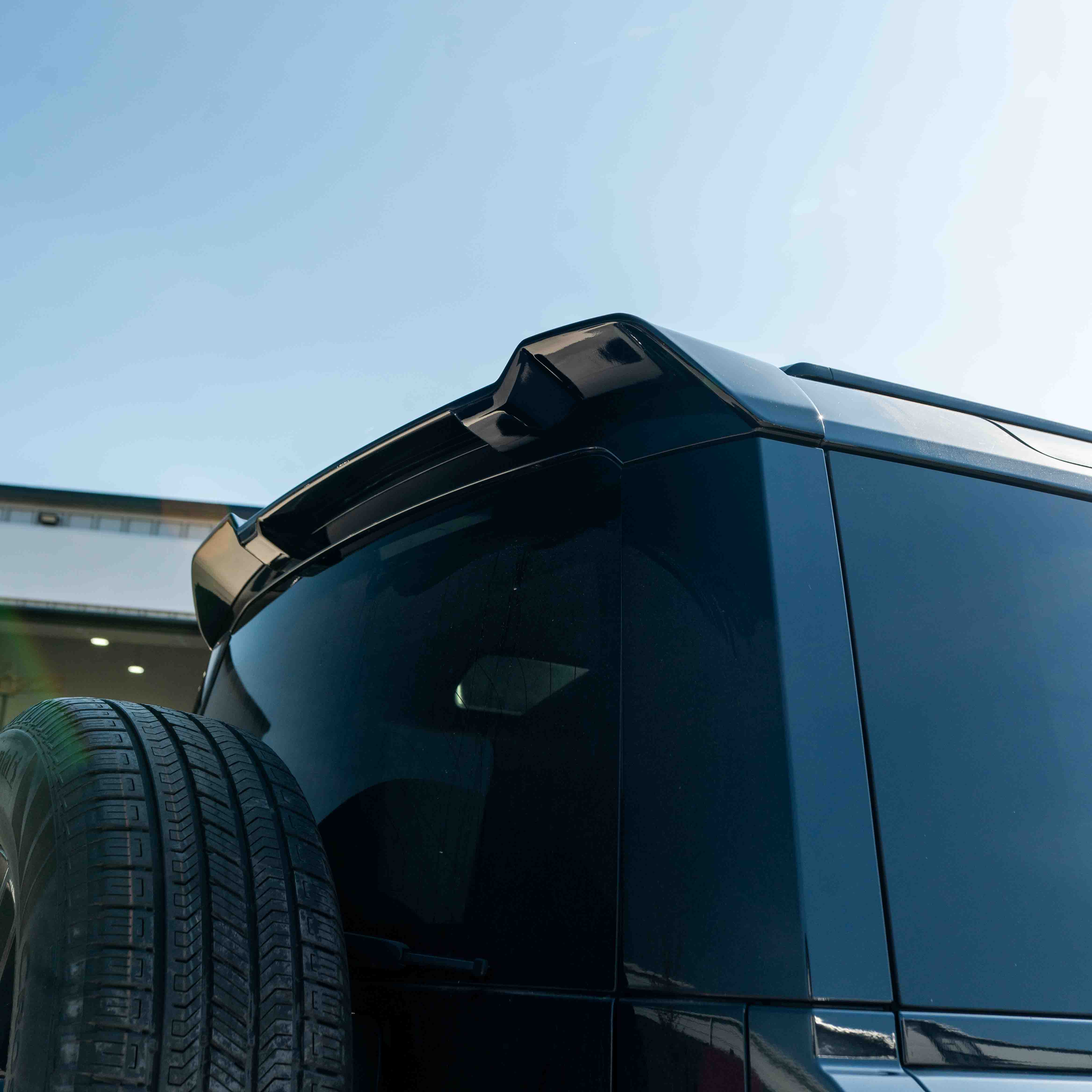 CT Carbon Land Rover Defender L663 110 & 90 gloss black front and rear middle trim kit installed on vehicle.