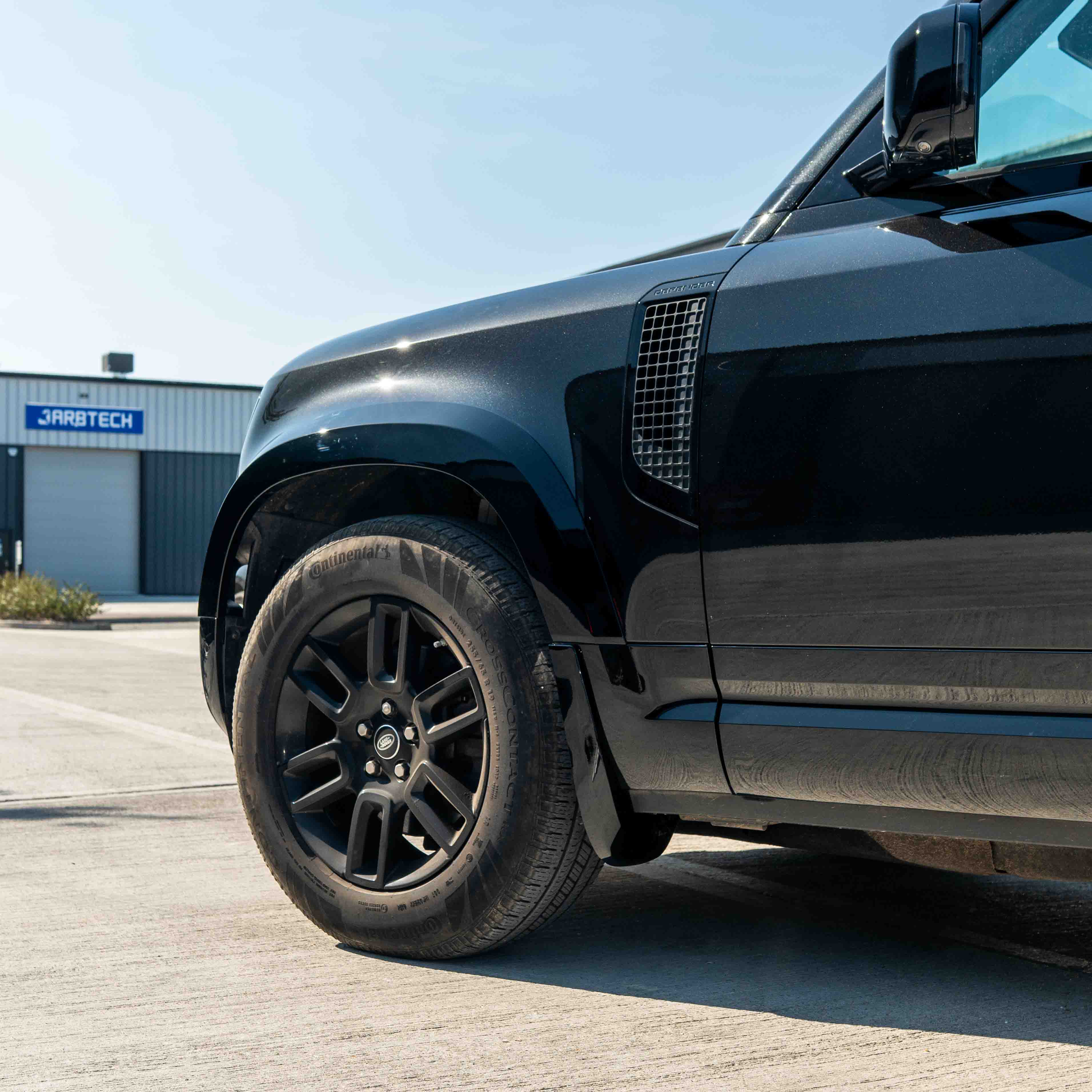 CT Carbon Land Rover Defender L663 110 & 90 gloss black front and rear middle trim kit, for enhanced vehicle interior style.