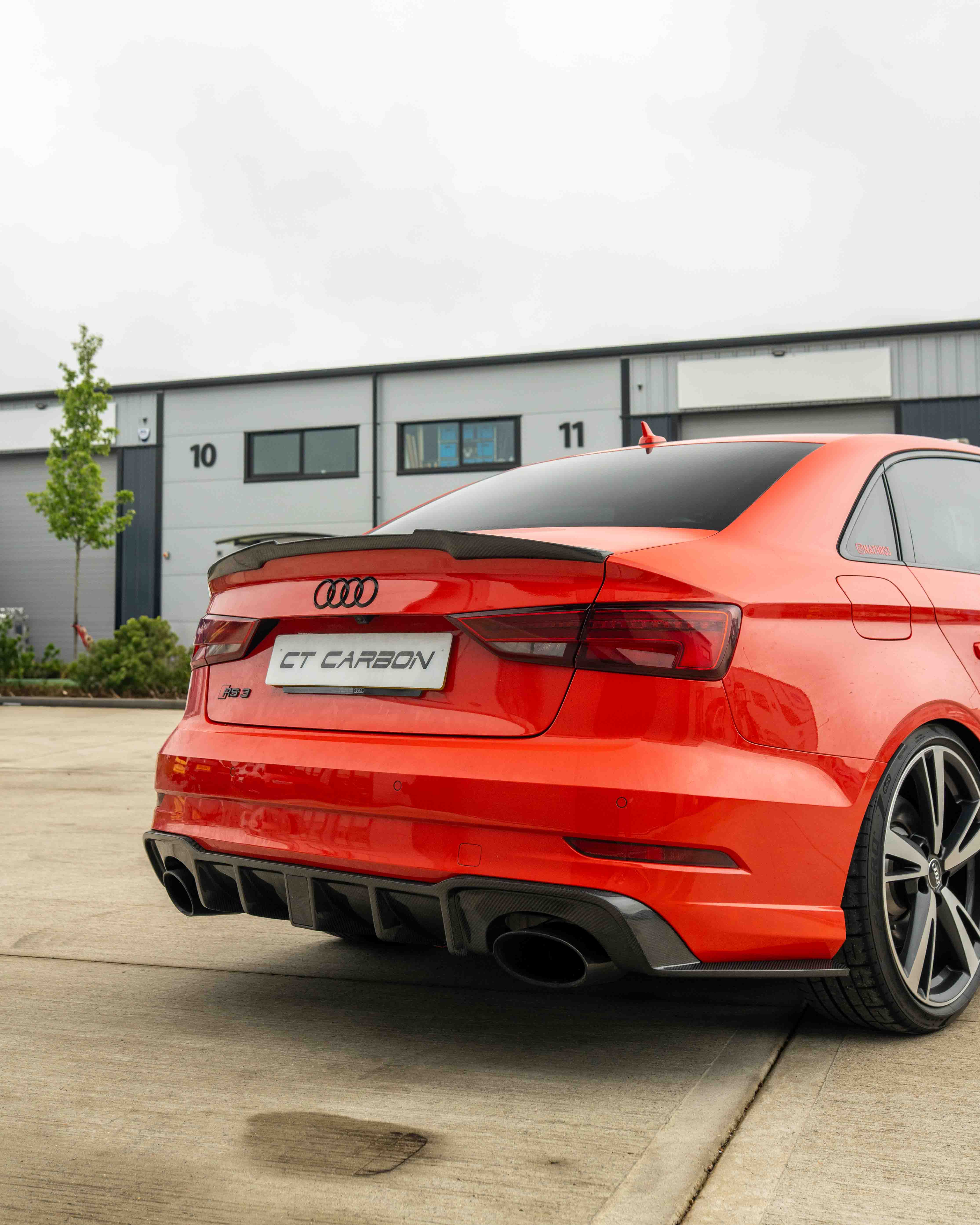 CT Carbon Audi RS3 8V saloon rear carbon diffuser with DTM light, showcasing sleek design and sporty performance features.