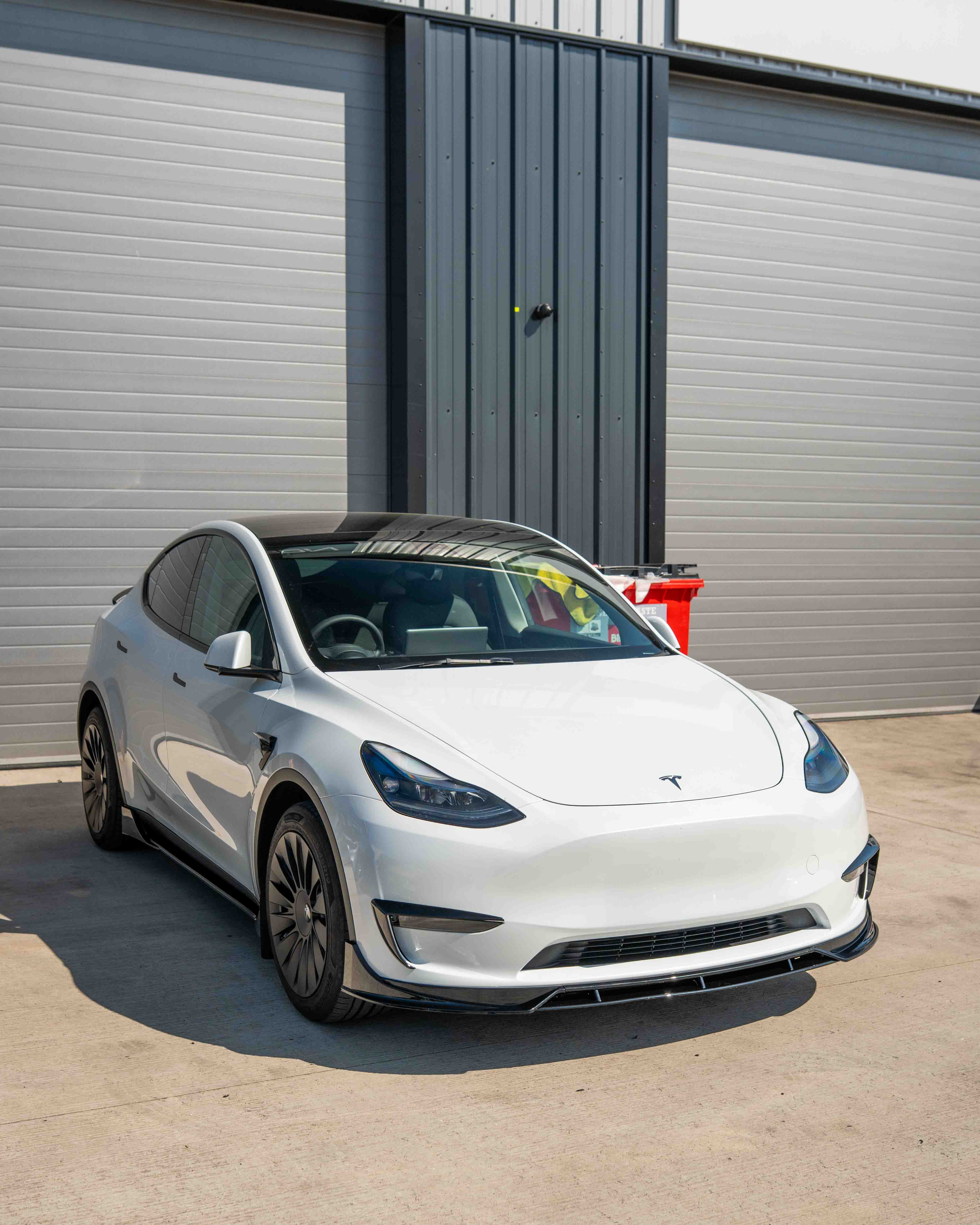 Full gloss black kit for Tesla Model Y MK1 2020-2025 by CT Carbon, including detailed close-up of the kit components.