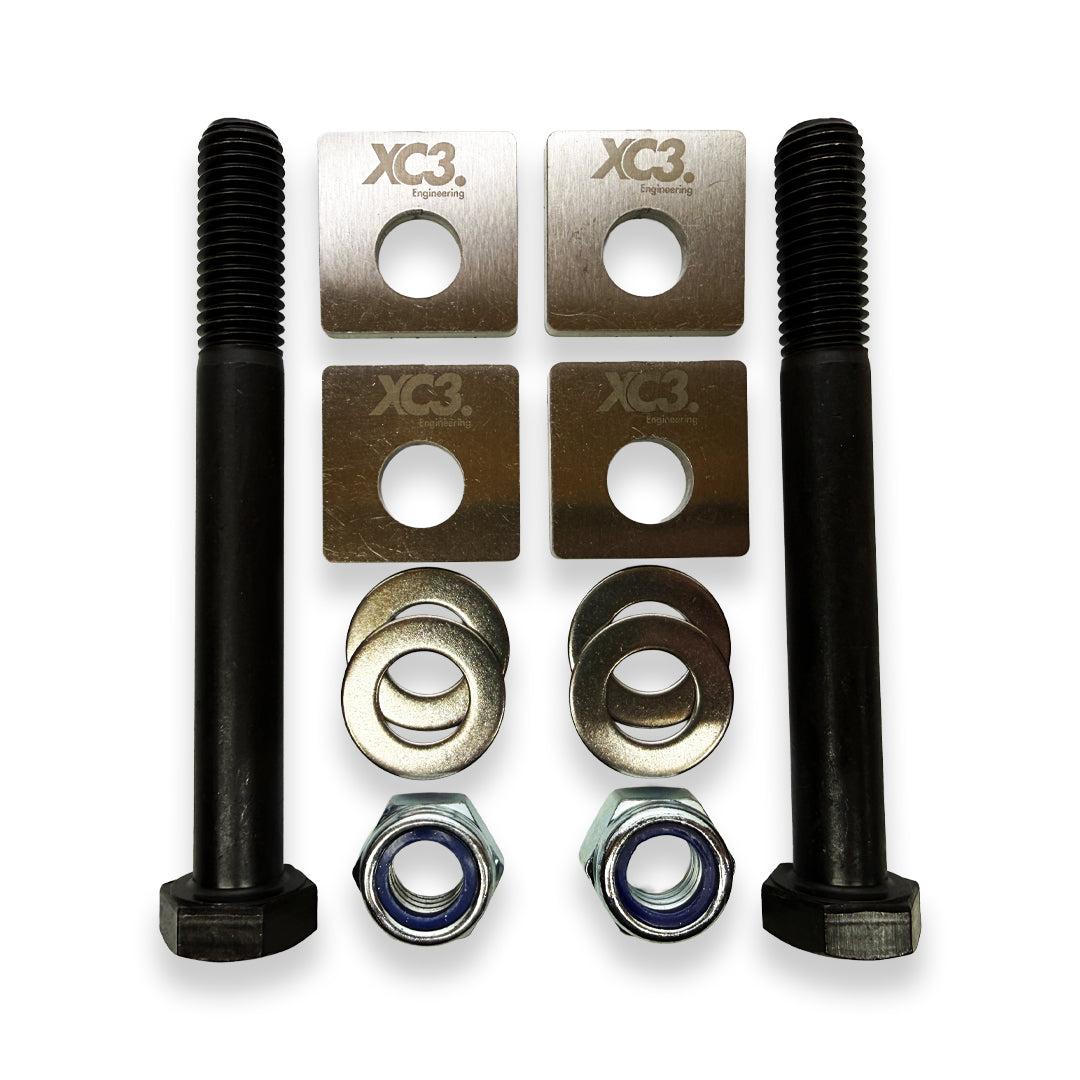 BMW M3 E9X E92 camber lockout shims for suspension alignment by XC3 Engineering, showing the metal shims for camber adjustment.