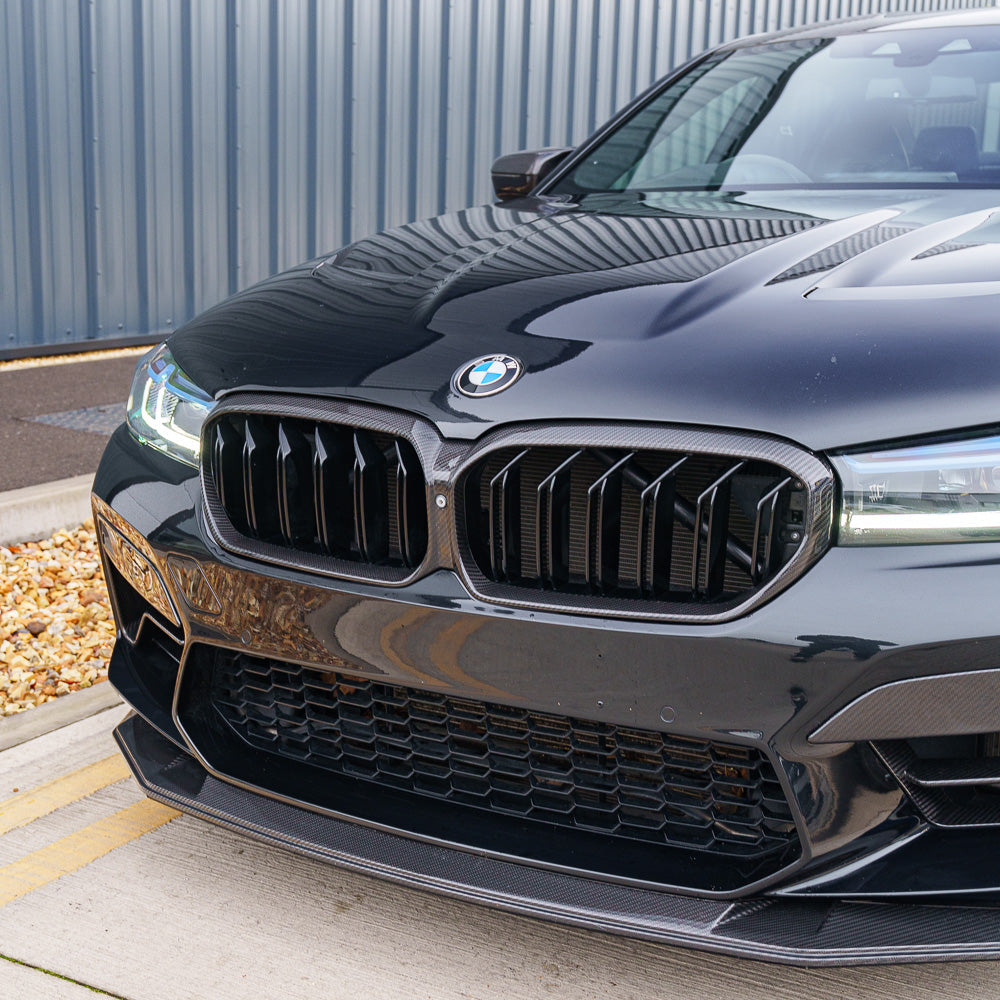BMW F90 M5 and G30 G31 5 Series LCI carbon fibre grille by CT Carbon, showcasing the sleek, textured design on a luxury car.