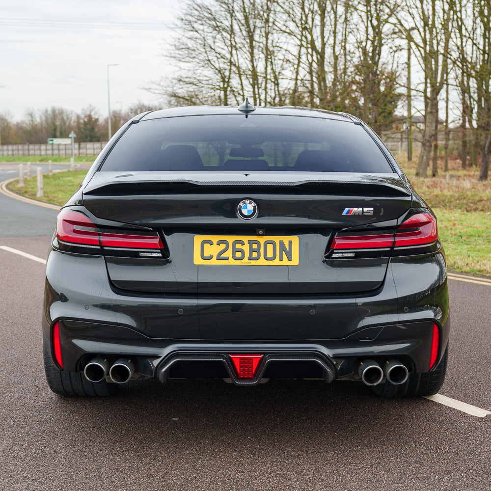 BMW M5 F90 2018-2024 CT Carbon pre-preg carbon fibre diffuser with LED lights, showcasing sleek design and high-quality craftsmanship.
