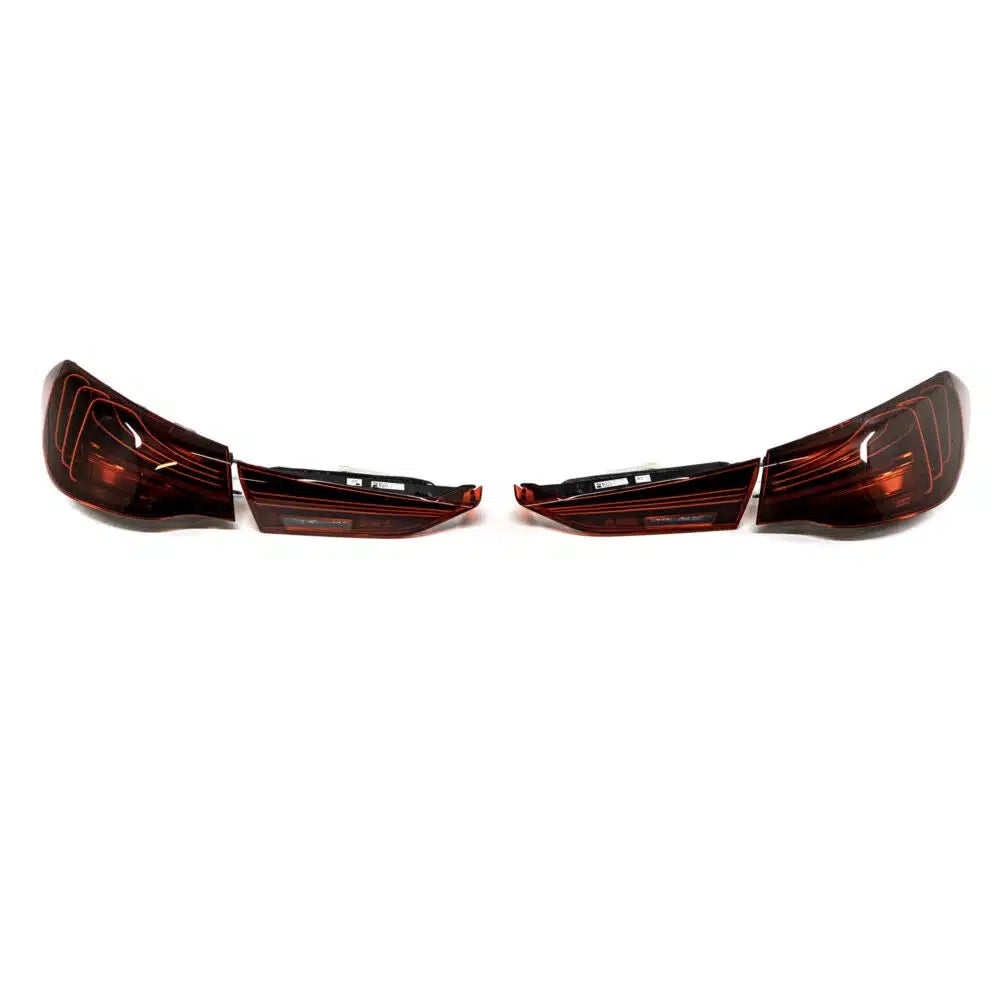 Genuine BMW G82 G83 LCI CSL laser tail light set showing sleek red and clear LED taillights with branding details.