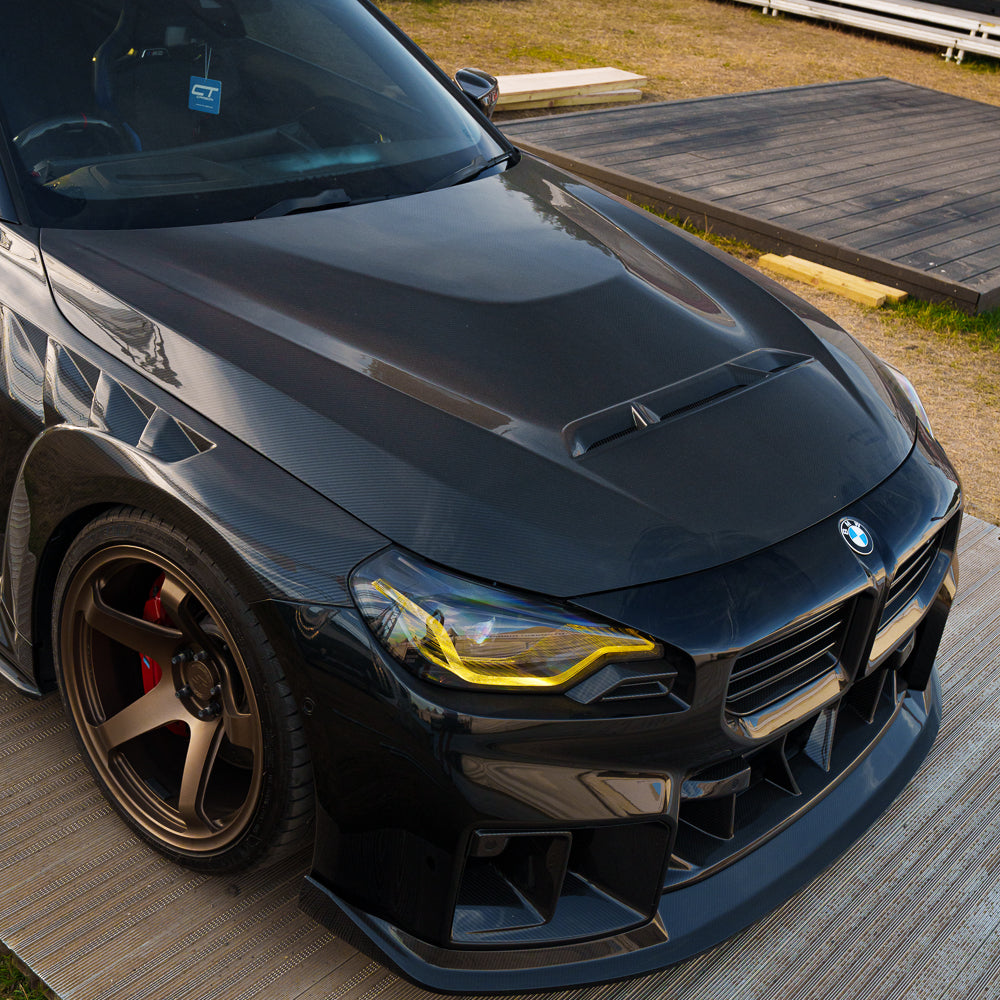 BMW G42 2 Series and G87 M2 carbon fibre front bonnet by CT Carbon, showcasing lightweight, performance-enhancing hood with detailed finish.