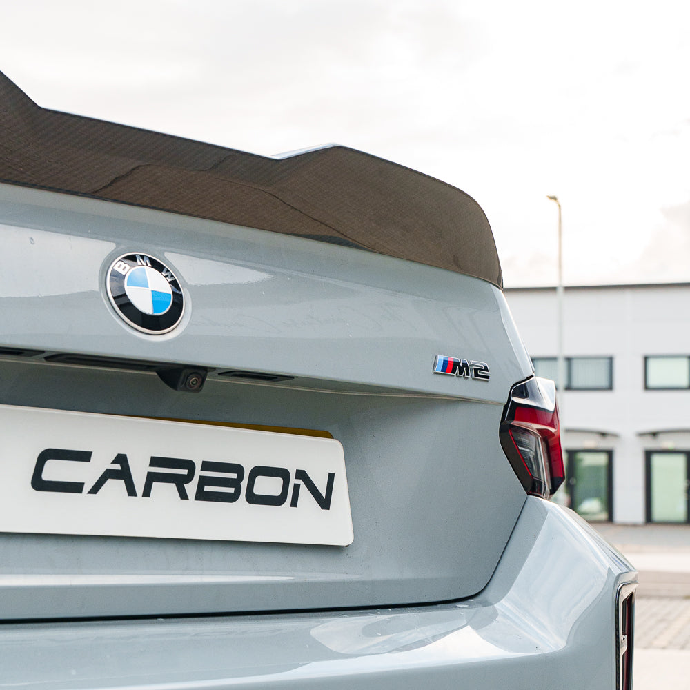 BMW G87 M2 full carbon fiber kit by CT Carbon, showcasing lightweight, high-quality carbon fiber components on a sleek car.