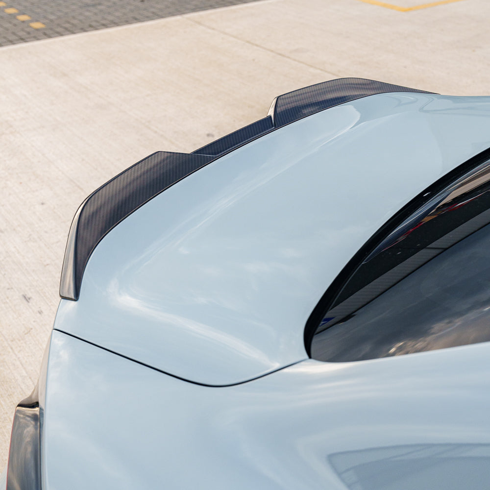 BMW G87 M2 full carbon fiber kit by CT Carbon, showcasing sleek, lightweight carbon fiber components on a sporty car.