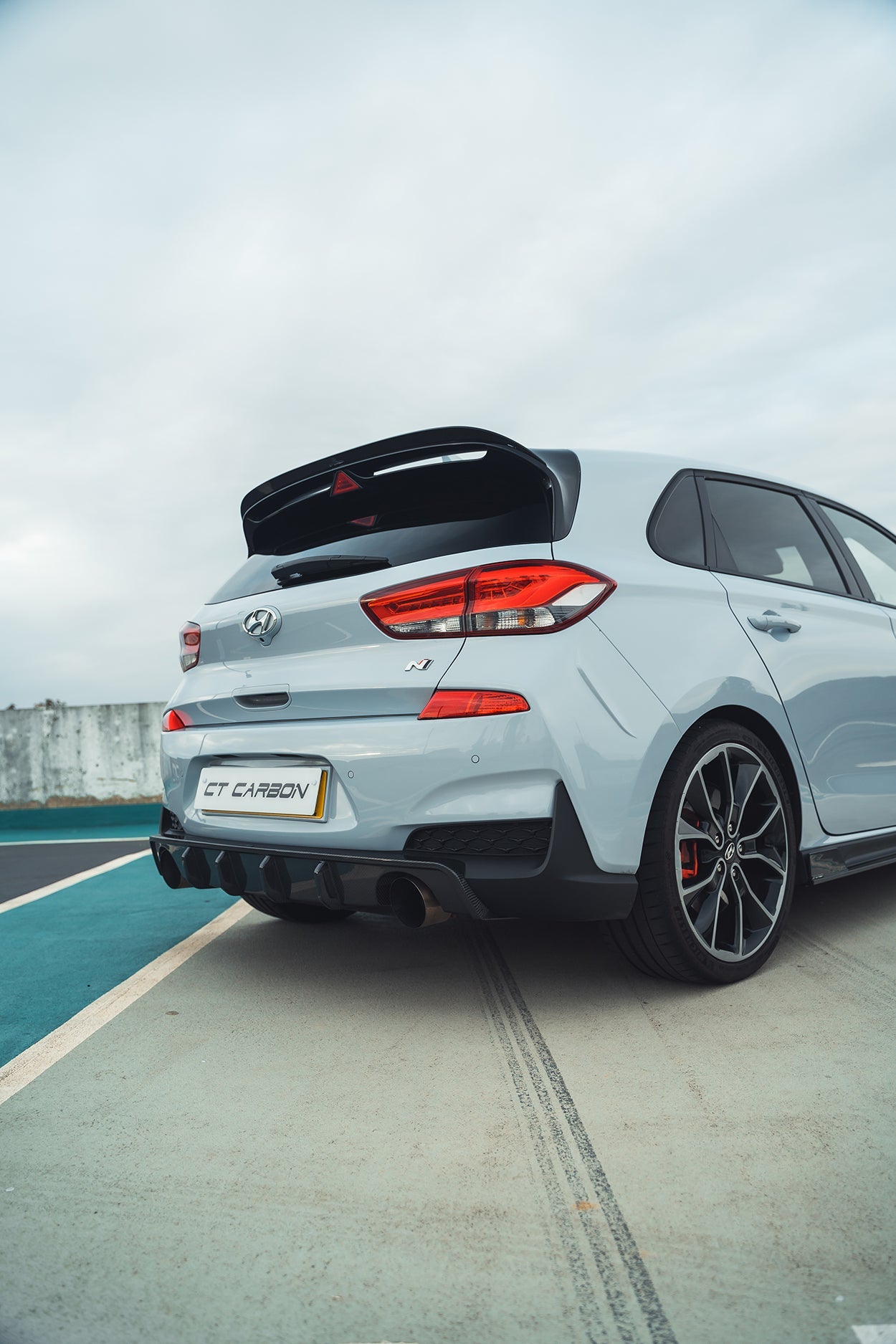 Pre-facelift Hyundai i30N carbon fibre kit by CT Design, showing sleek carbon fibre accents and detailed components.