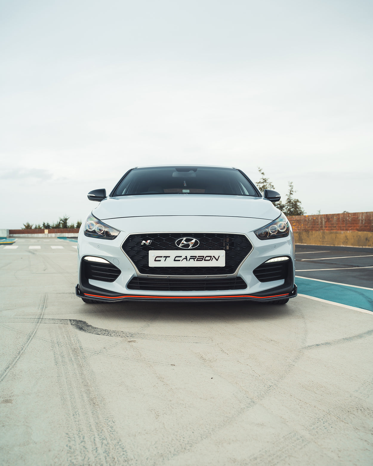Hyundai i30N carbon fibre kit by CT Design, pre-facelift model, showing sleek carbon fibre accents on the car's exterior.