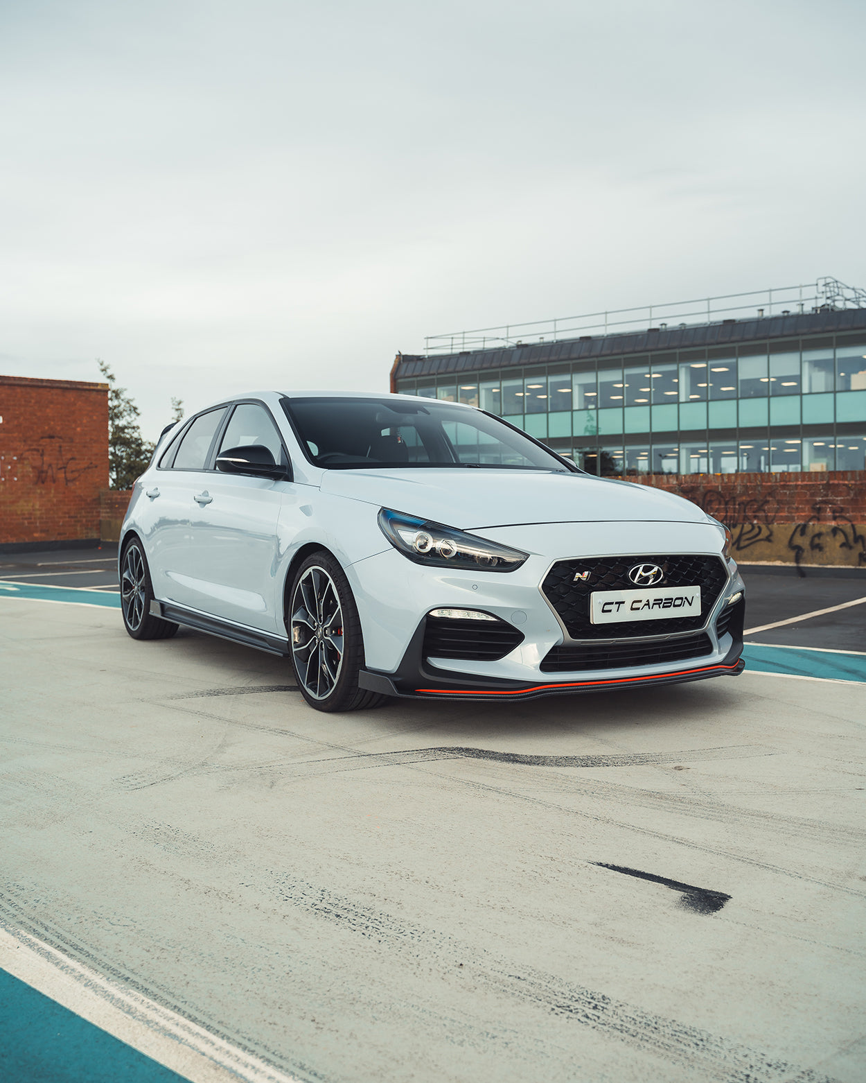 Hyundai i30N carbon fiber kit by CT Design, pre-facelift model, showing close-up of sleek carbon fiber components and finish.