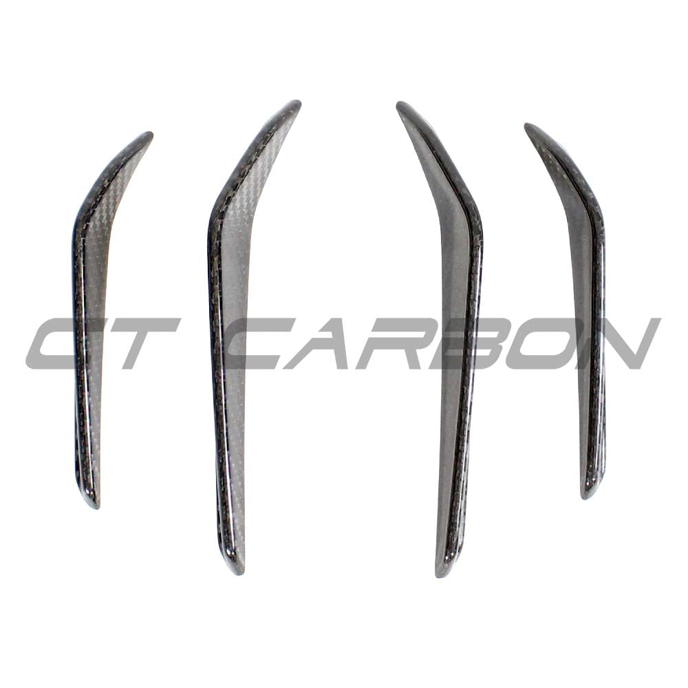 BMW M3/M4 G80 G81 G82 G83 carbon fiber front bumper canards by CT Carbon, showing close-up of aerodynamic car accessories.
