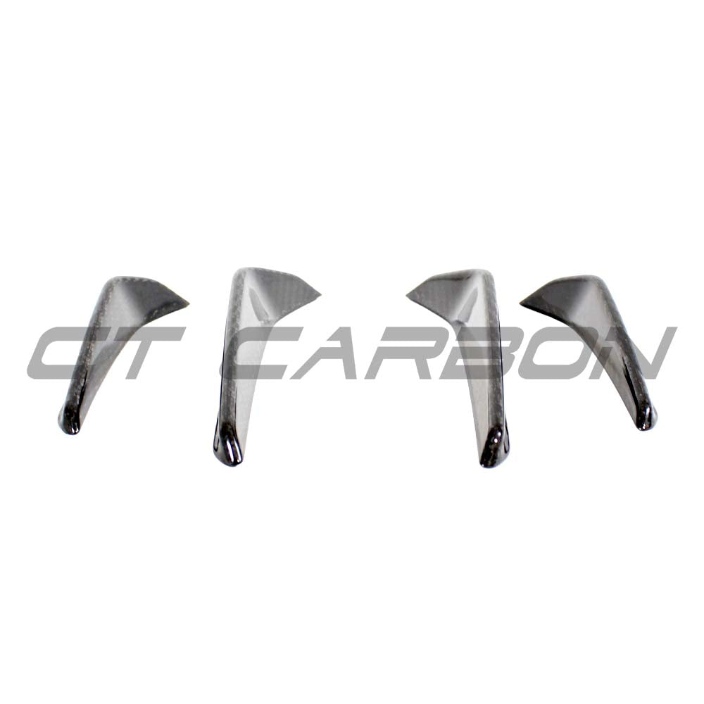 BMW M3 M4 G80 G82 carbon fibre front bumper canards by CT Carbon, performance car accessories, visible on the front bumper.