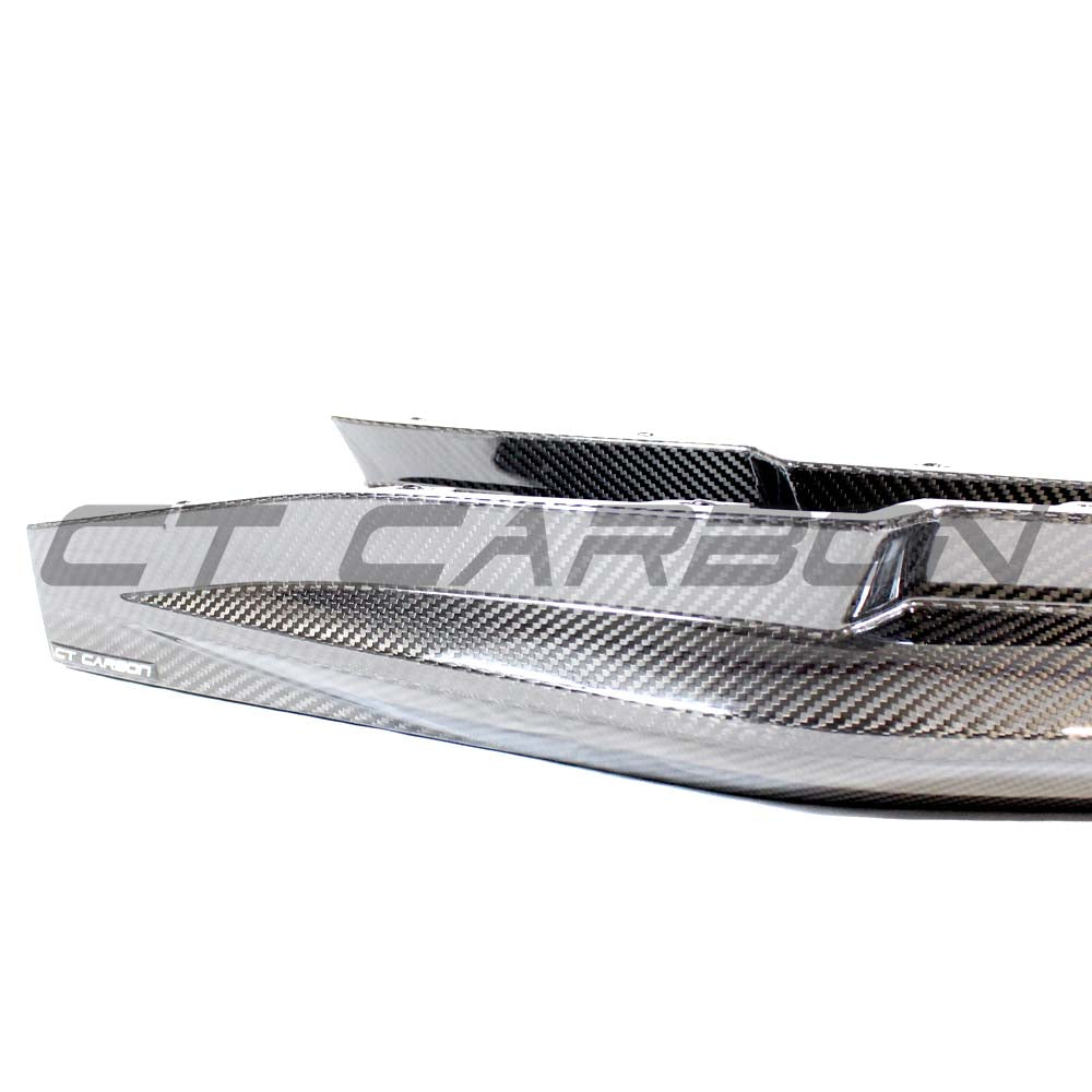 BMW M3 G80/G81 carbon fibre rear bumper corners accessory by CT Carbon, showing close-up of sleek, high-quality carbon fibre details.