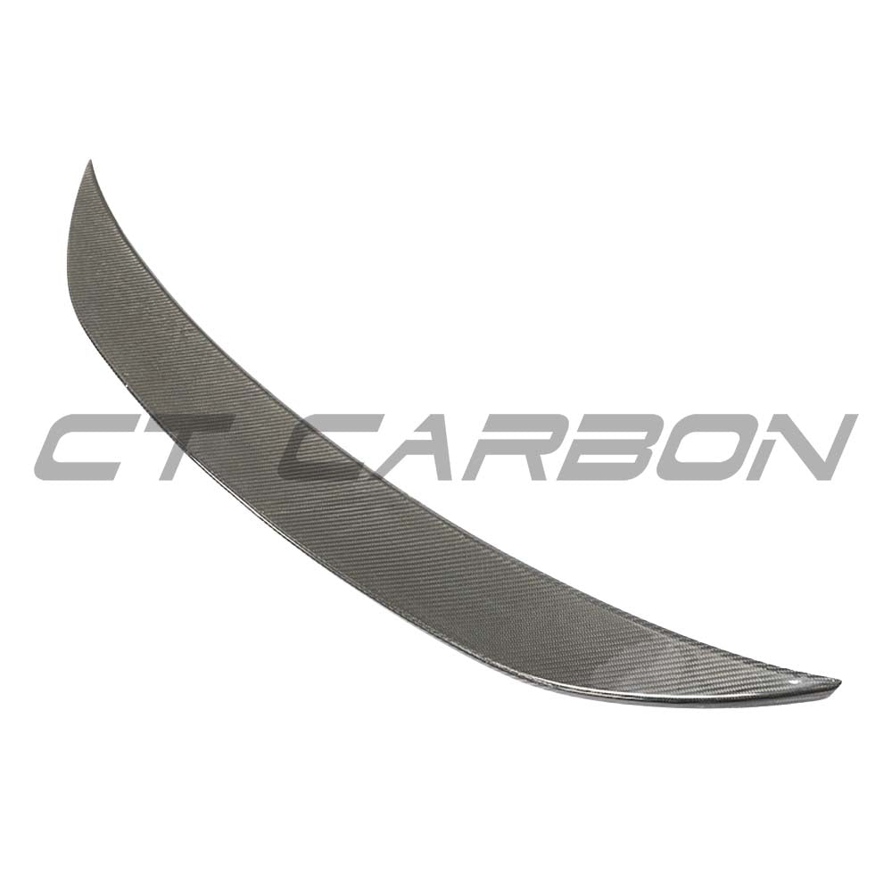 Mercedes E63 W213 2018-2020 pre-facelift carbon fibre spoiler by CT Carbon, showing the sleek, aerodynamic design on the car's rear.