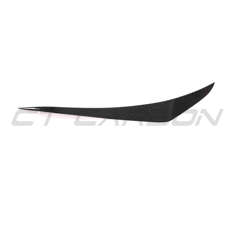 CT Carbon Porsche 911 991.1 Turbo carbon fibre canards, automotive accessories, shown on the side of the sports car.