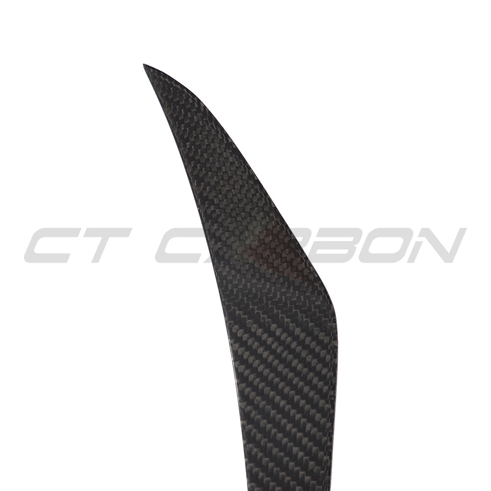 Carbon fibre canards for Porsche 911 991.1 Turbo 2013-2016, made by CT Carbon, shown attached to the front of the car.