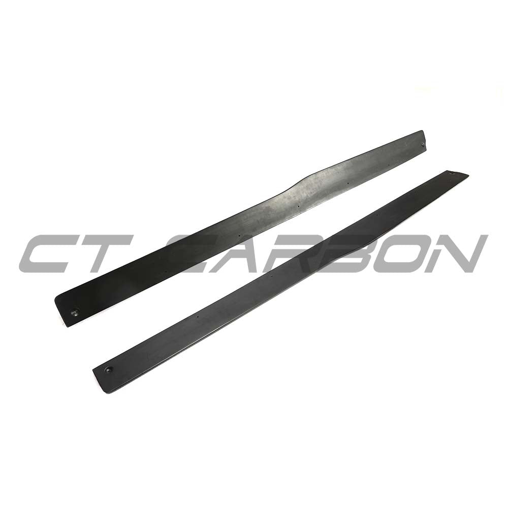 BMW F80 M3 2014-2020 carbon fibre side skirts by CT Carbon, featuring sleek, lightweight design for enhanced vehicle aerodynamics.