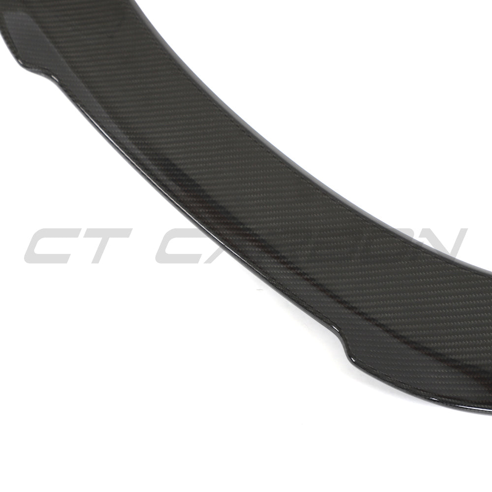 Toyota Supra 2019+ A90 carbon fiber spoiler by CT Carbon, shown mounted on the sporty car with detailed textured finish.